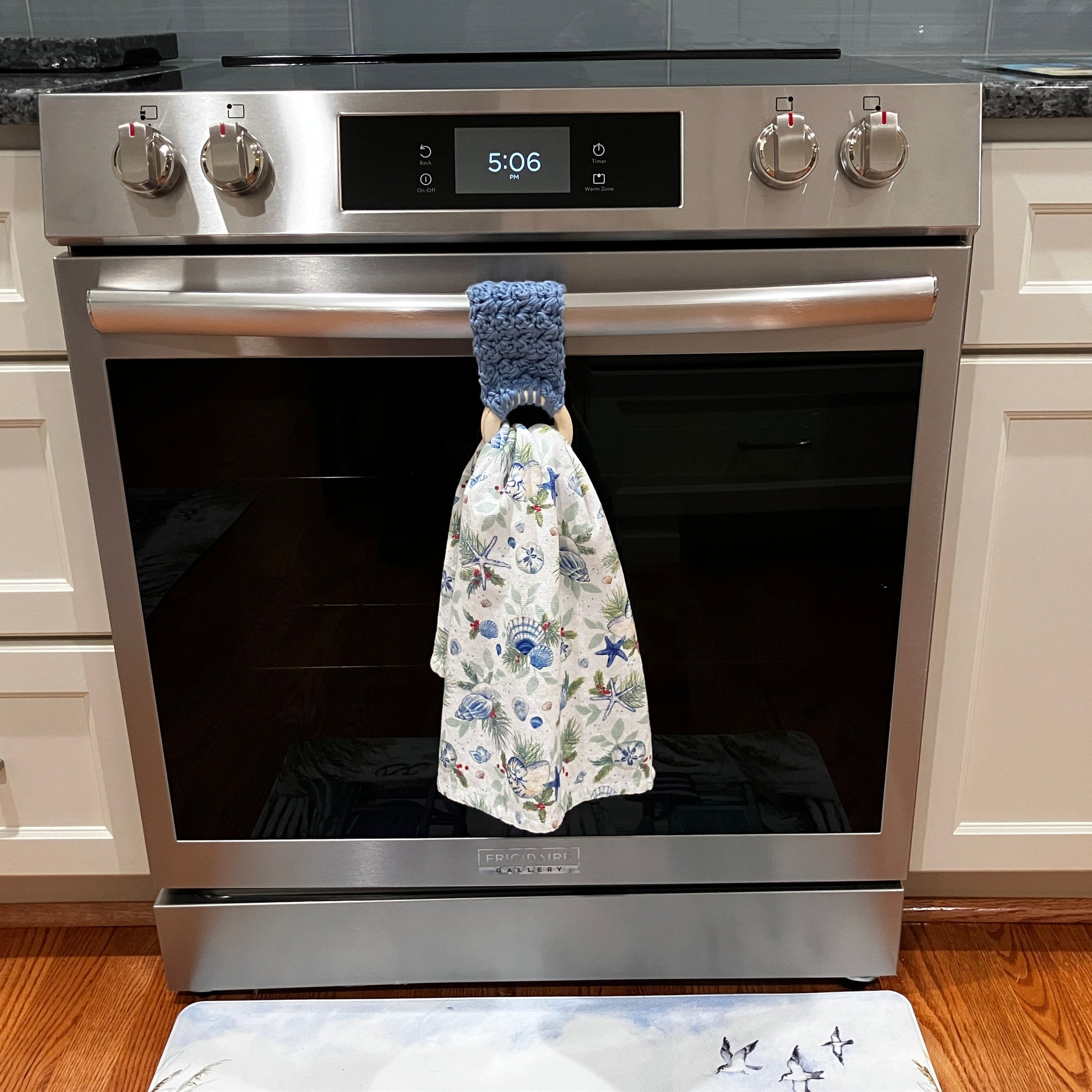 Stone Wash Blue Towel Holder, Displayed on Oven